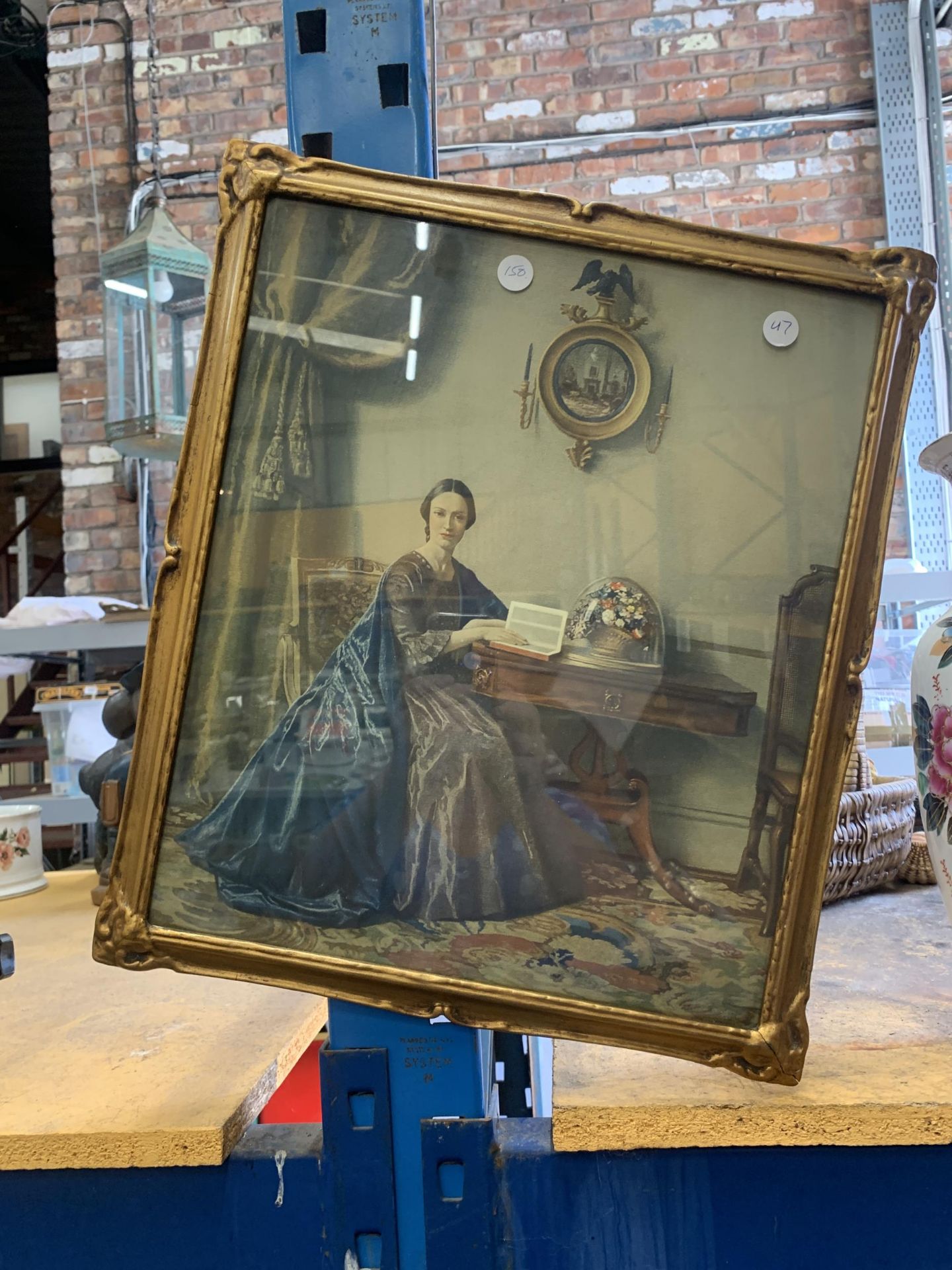 A FRAMED VICTORIAN PRINT IN A GILT FRAME