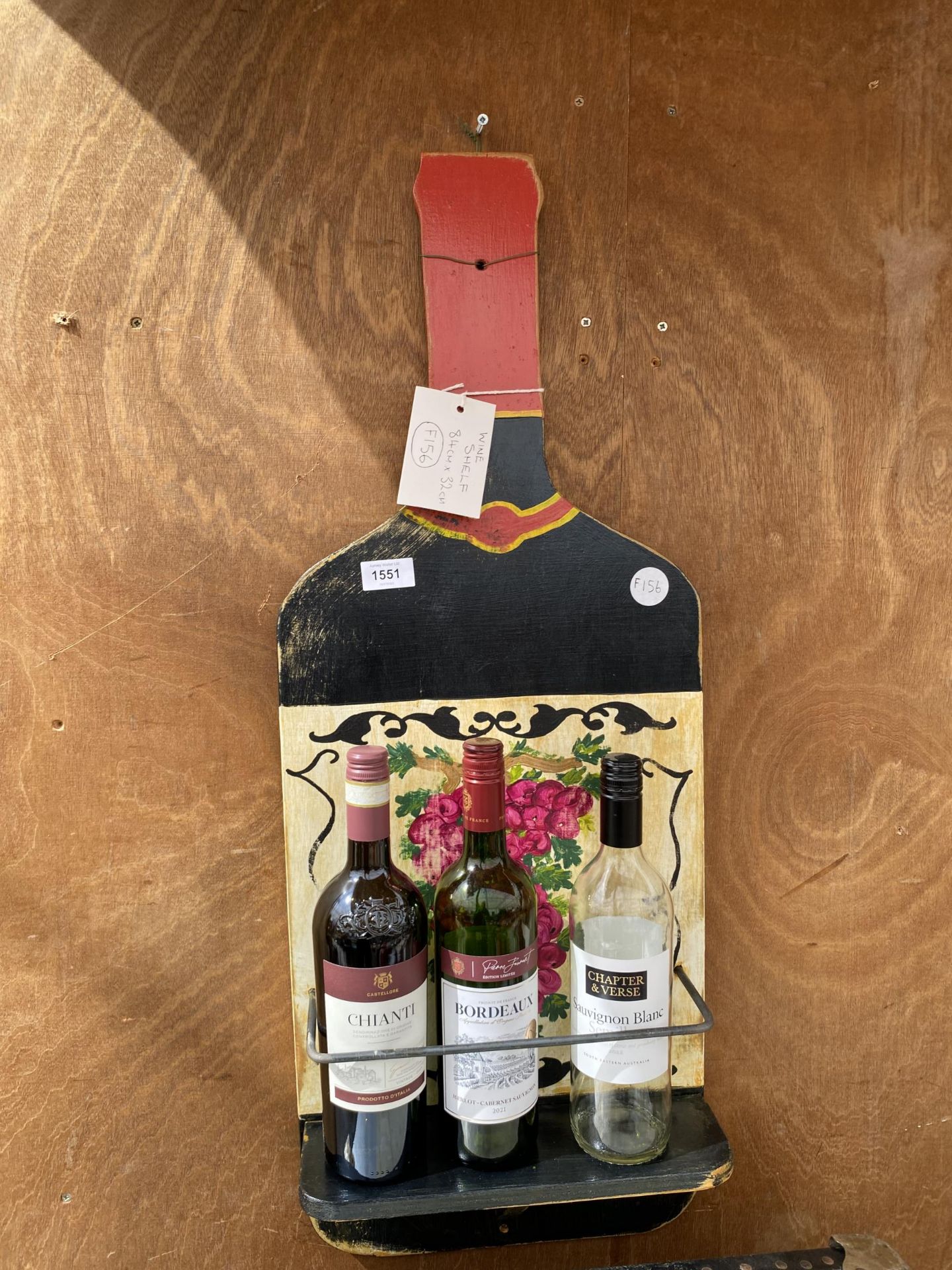 A HAND PAINTED PLY WOOD WINE BOTTLE SHELF, 84X32CM