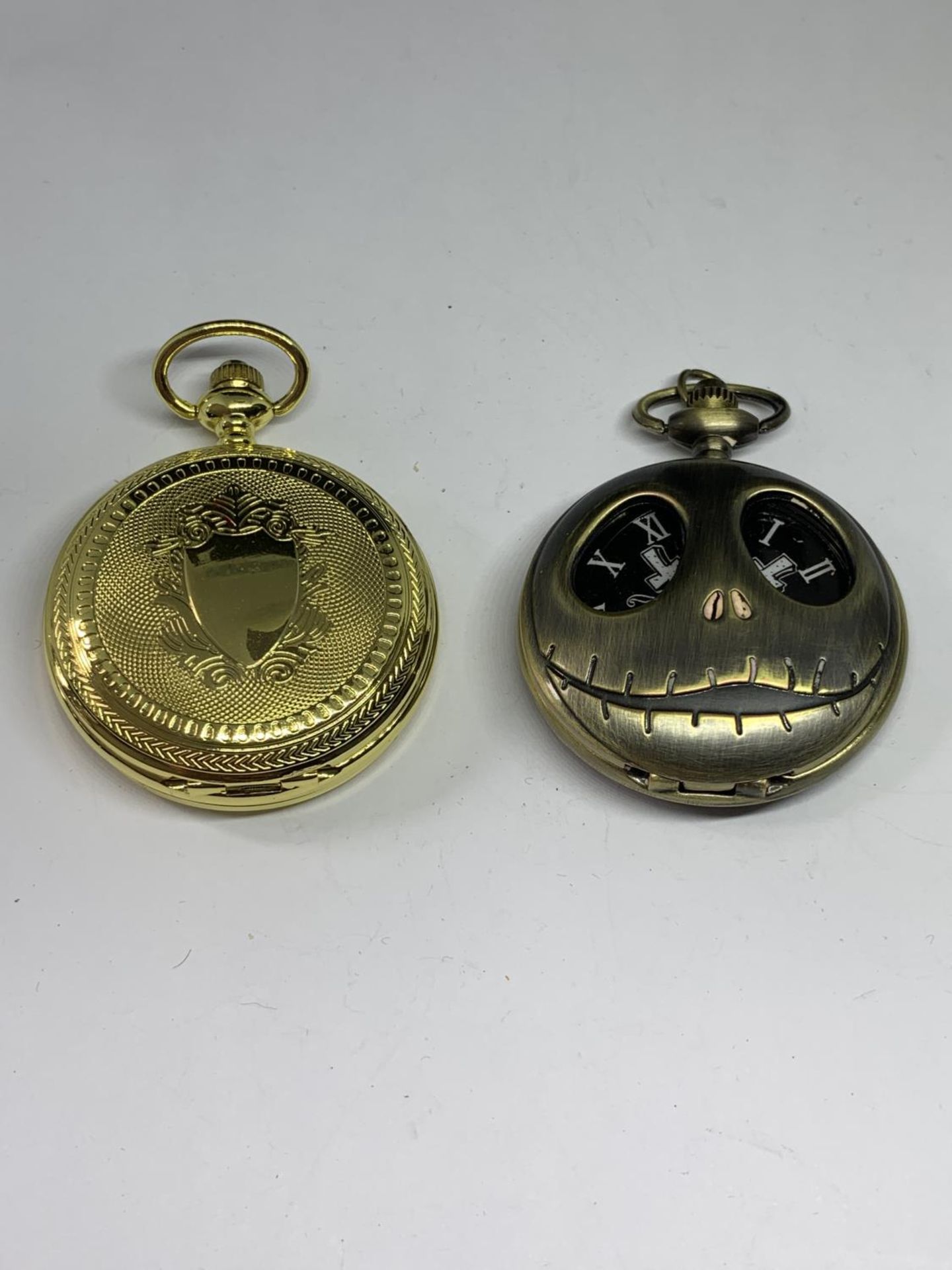 TWO POCKET WATCHES ONE WITH SPOOKY FACE BOTH SEEN WORKING BUT NO WARRANTY