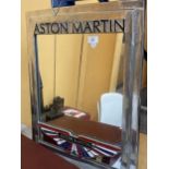 AN ASTON MARTIN CHROME EFFECT MIRROR