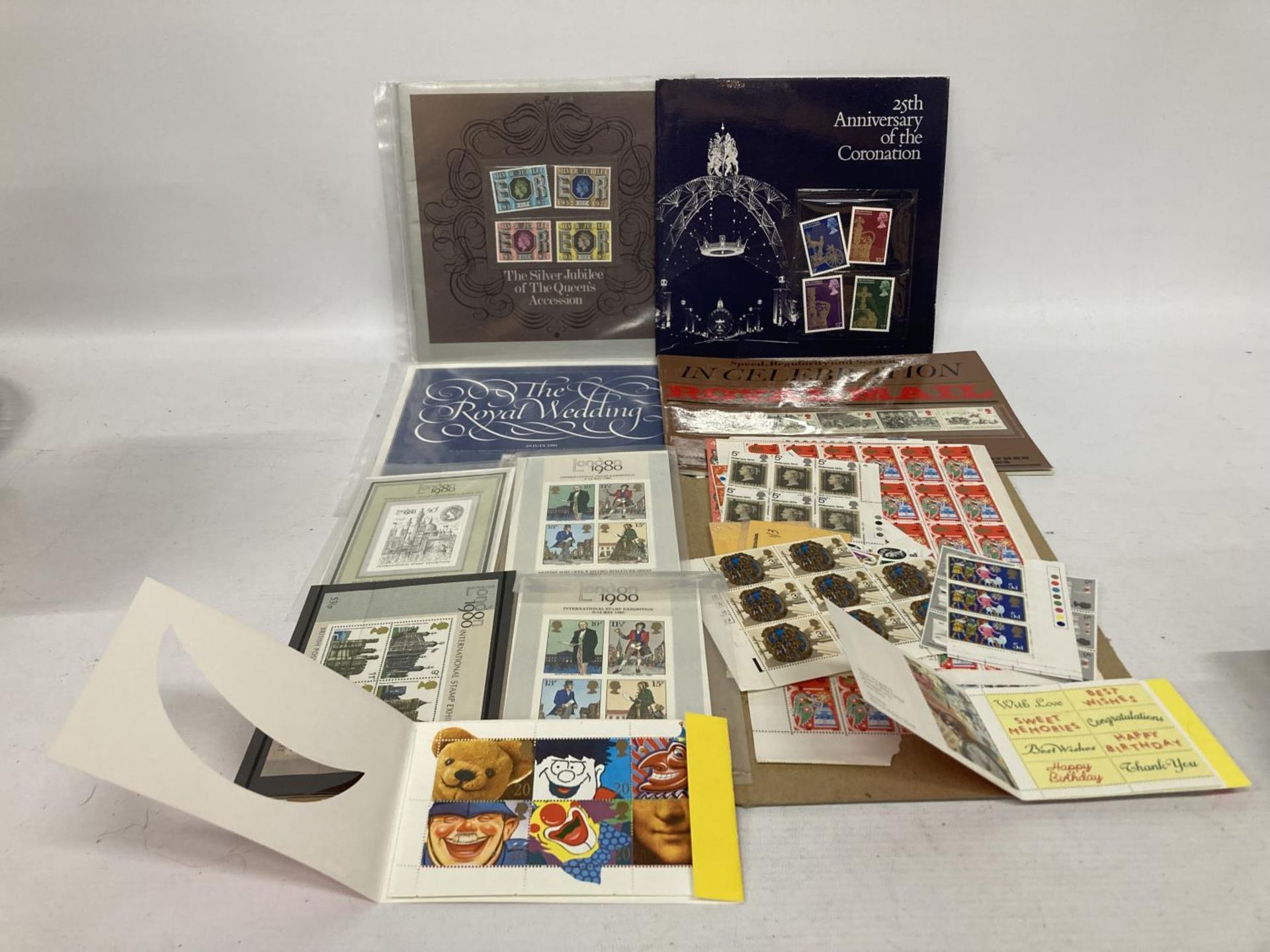 A MIXED LOT OF STAMPS TO INCLUDE THE ROYAL WEDDING SOUVENIR FOLDER, ANNIVERSARY OF THE CORONATION