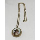 A VICTORIAN LOCKET WITH A CERAMIC FRONT WITH A PICTURE OF A YOUNG BOY