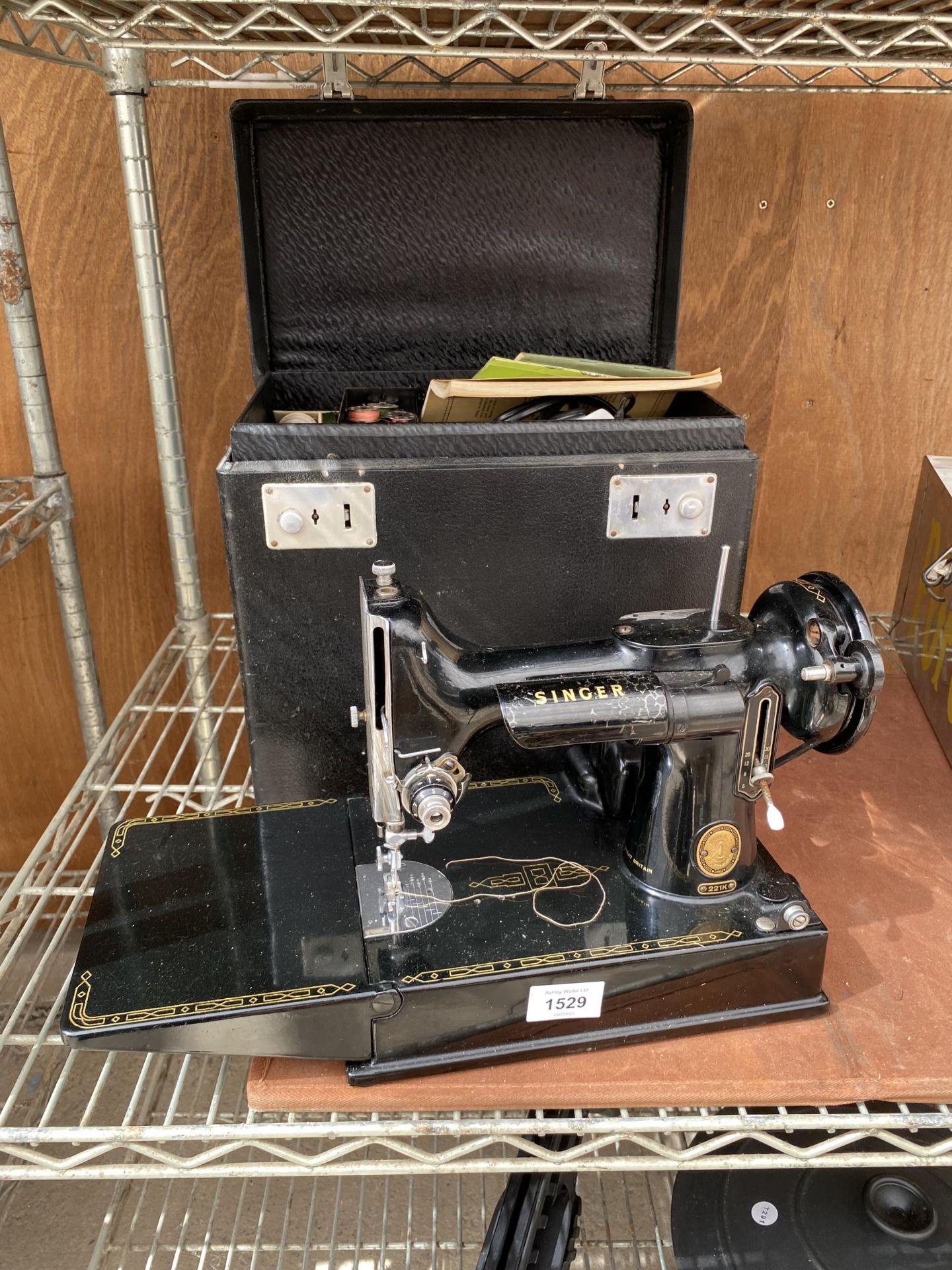 A VINTAGE SINGER 221K ELECTRIC SEWING MACHINE WITH CARTRY CASE AND USER MANUAL TO ALSO INCLUDE