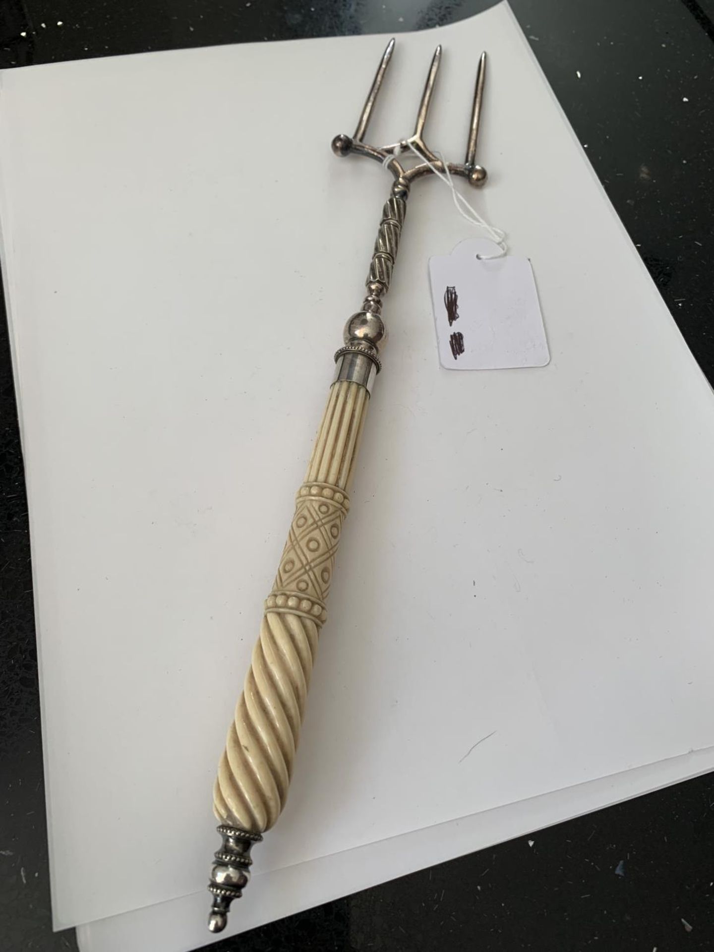 A CARVED BONE HANDLED TOASTING FORK