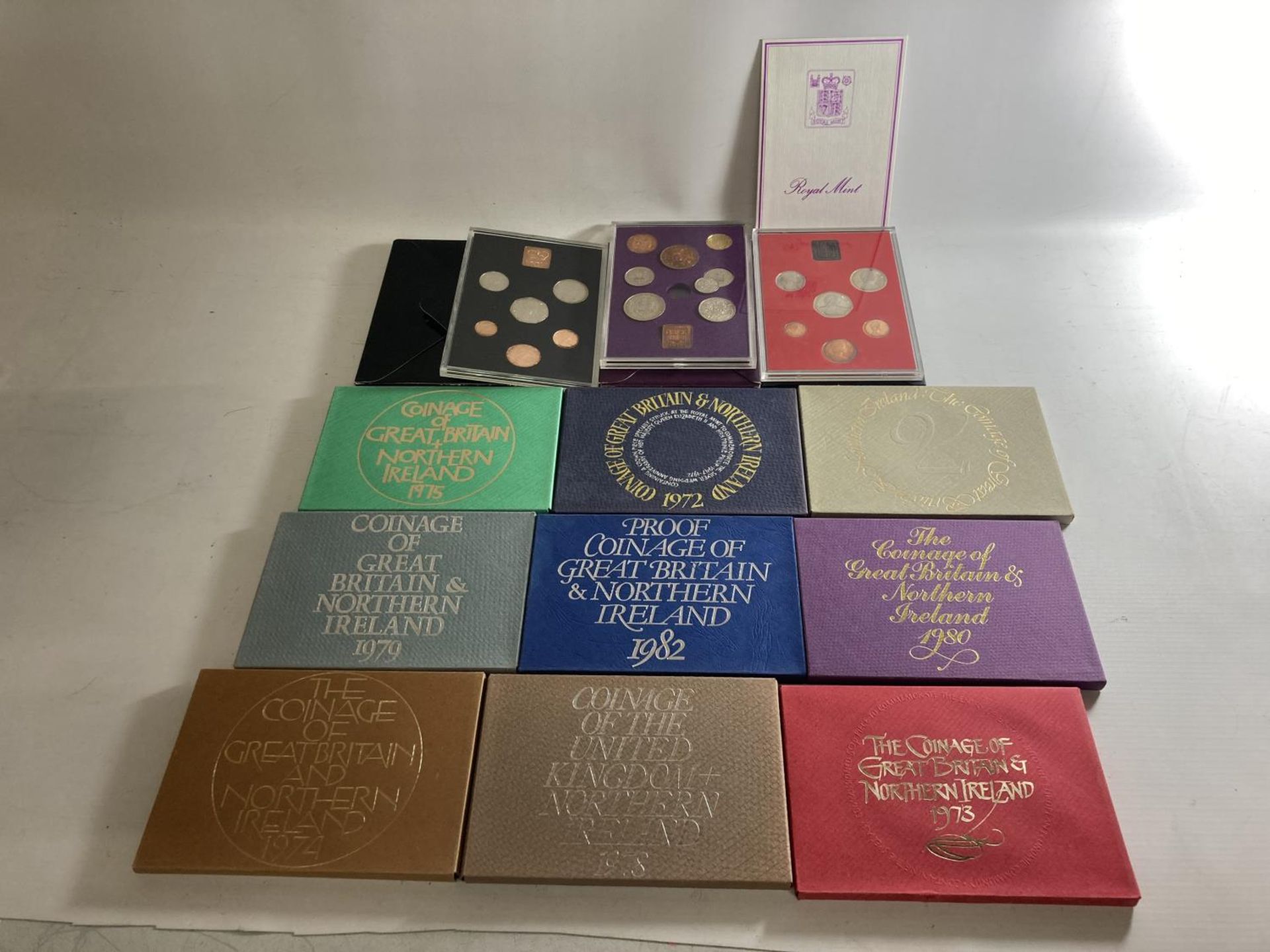 A SELECTION OF 12 UK COIN YEAR SETS , BEING : 1970-76 , 1978-82 , ALL PRISTINE CONDITION