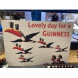 A TIN PLATE SIGN 'LOVELY DAY FOR A GUINNESS' 70CM X 50CM