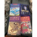 A HARRY POTTER ORGANISER AND THREE HARRY POTTER BOOKS