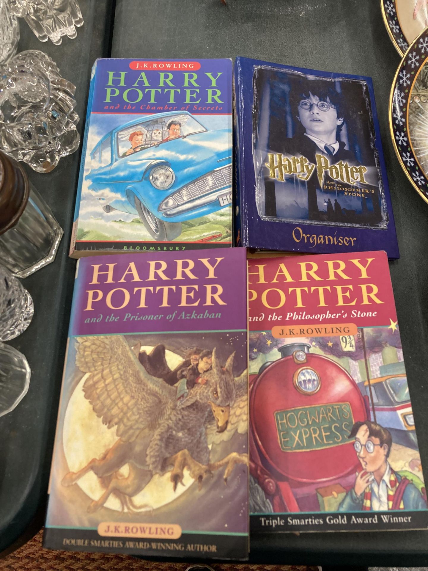 A HARRY POTTER ORGANISER AND THREE HARRY POTTER BOOKS