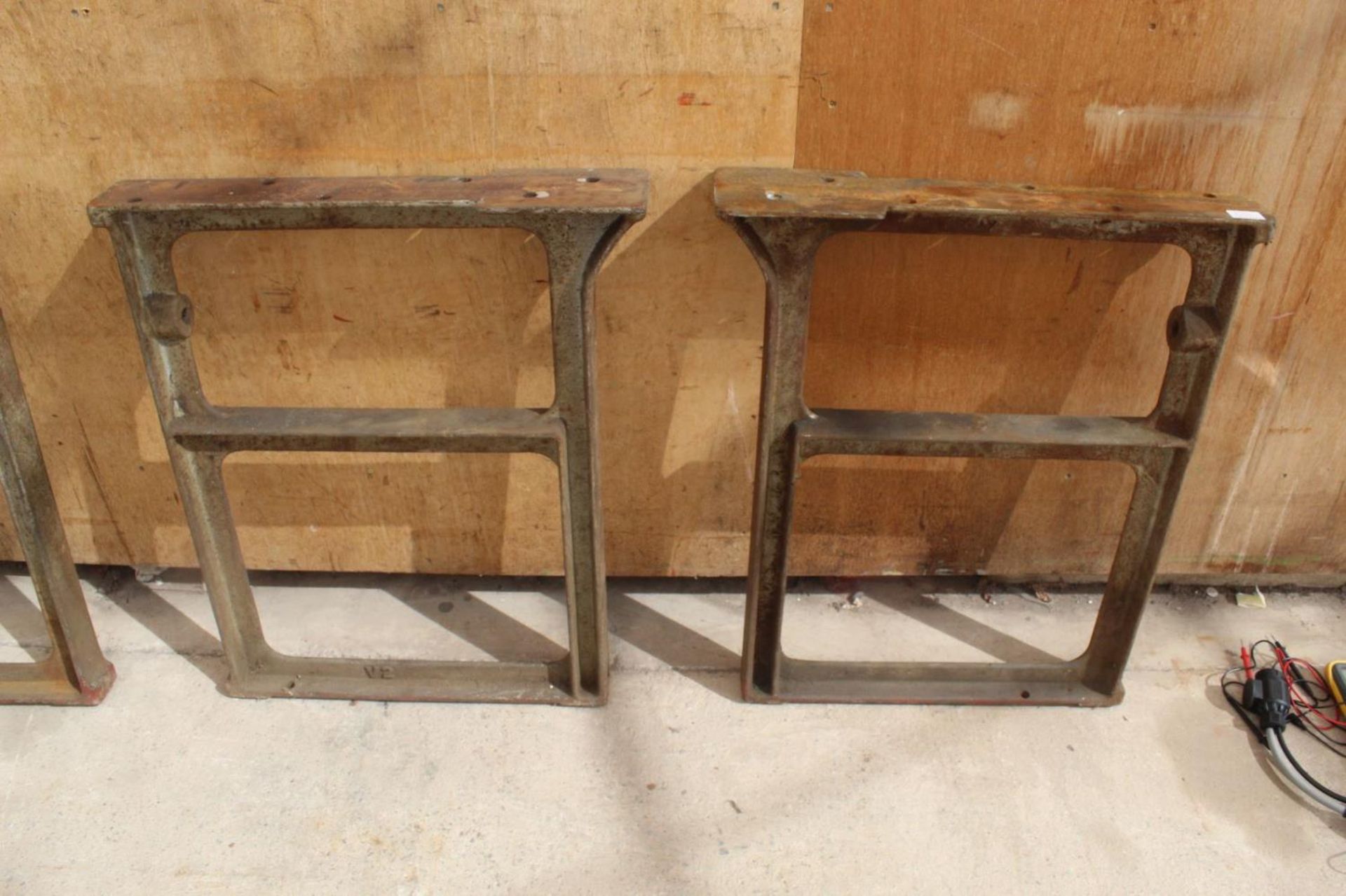 A PAIR OF HEAVY VINTAGE CAST IRON INDUSTRIAL WORKSHOP TABLE ENDS - NO VAT