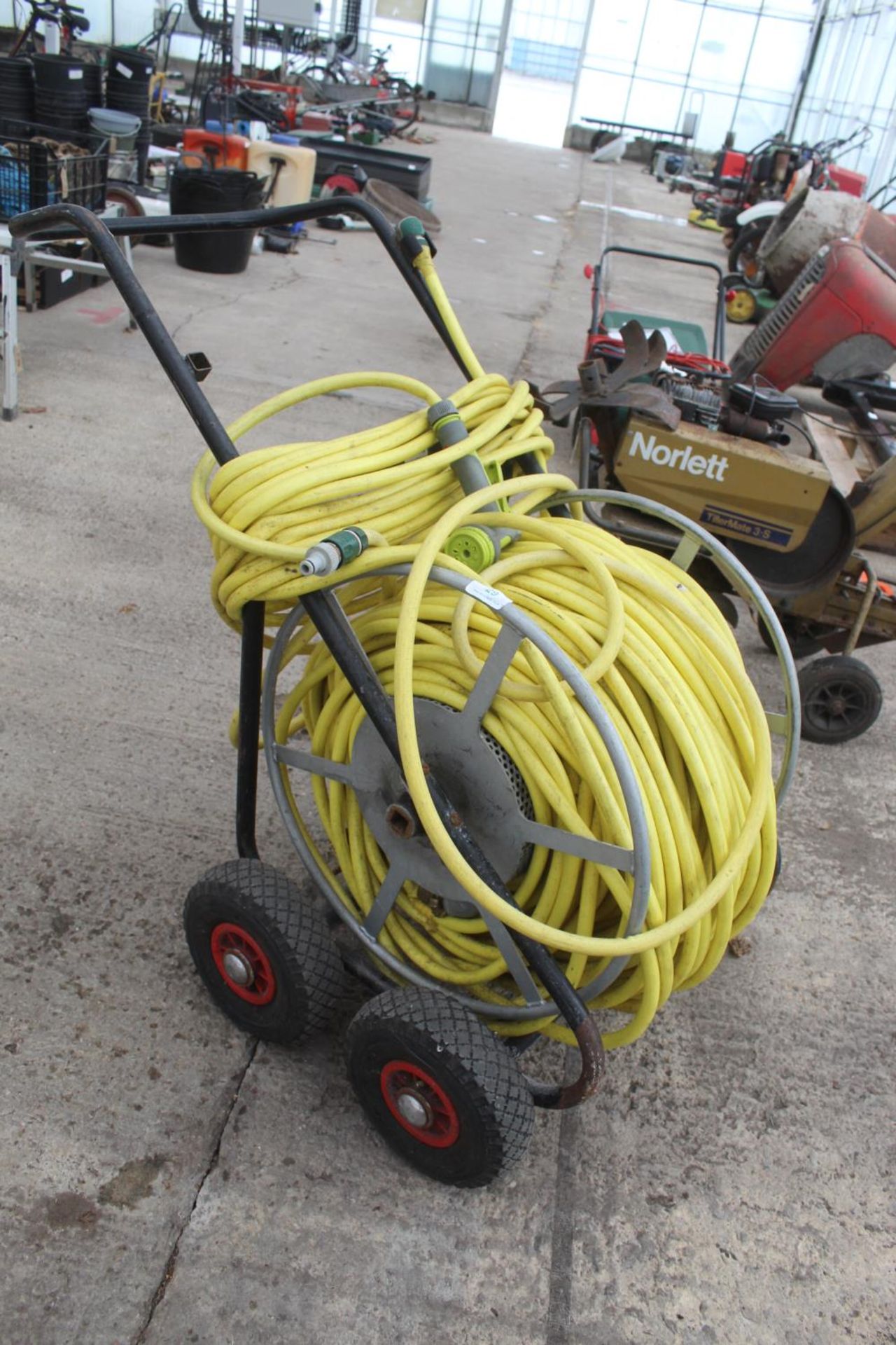A LARGE MARKET GARDENERS HOSE AND FOUR WHEELED TROLLEY REEL NO VAT