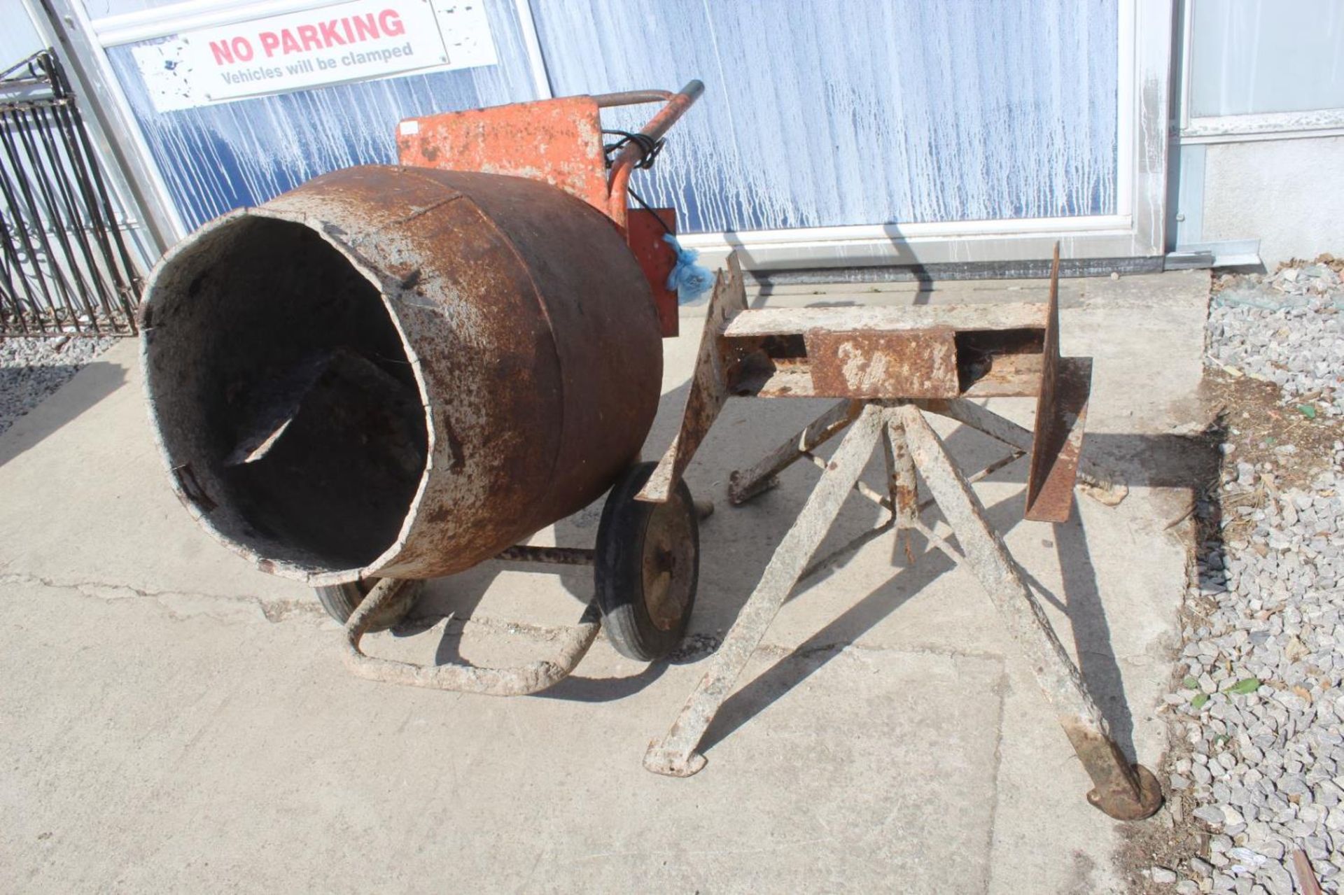 AN ELECTRIC CEMENT MIXER WITH A STAND - NO VAT