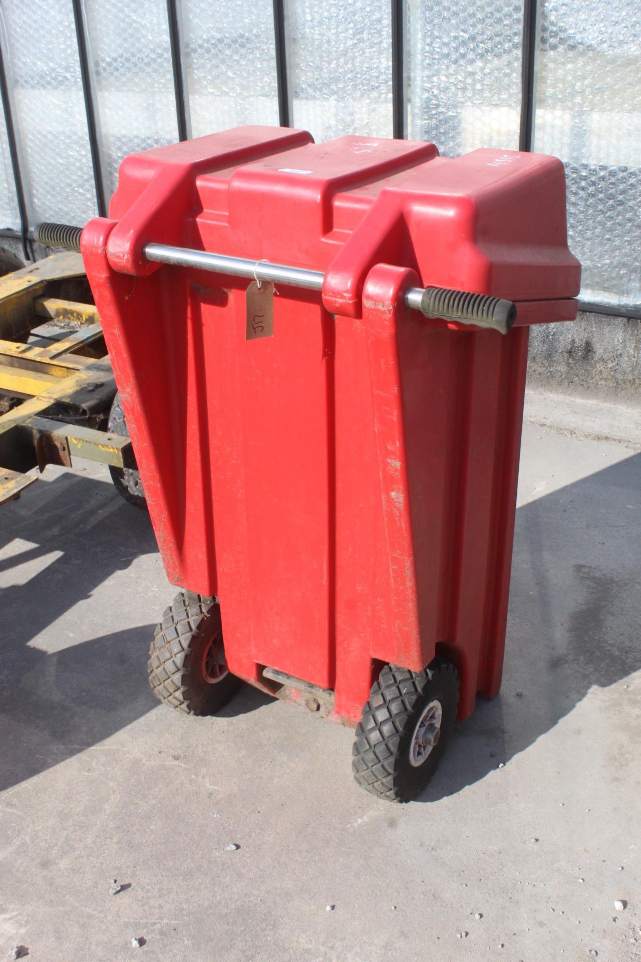 A TWO WHEELED PLASTIC STORAGE TROLLEY WITH FUEL A TANK AND MANUAL FUEL PUMP NO VAT