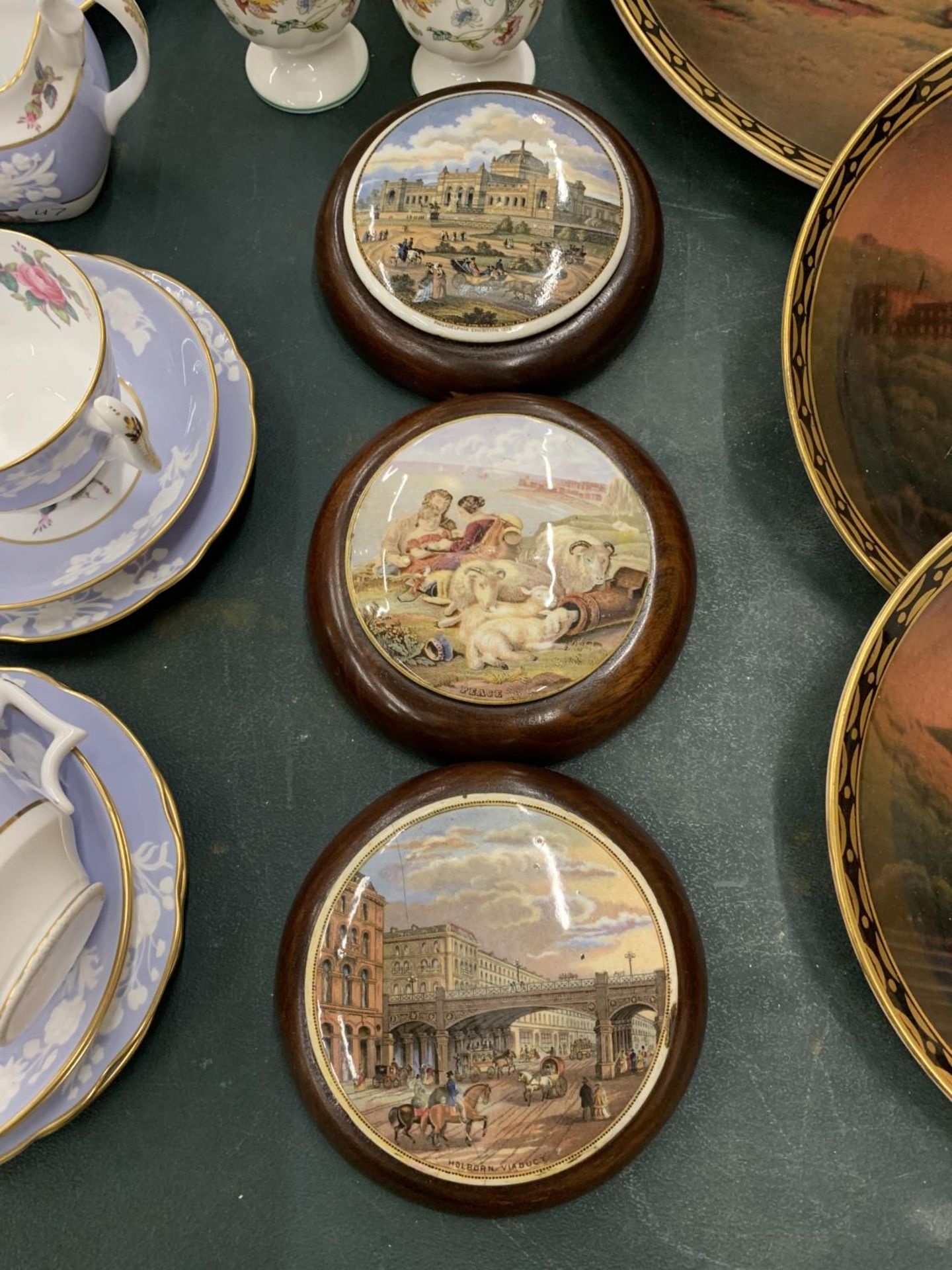 THREE MAHOGANY FRAMED PRATTWARE LIDS