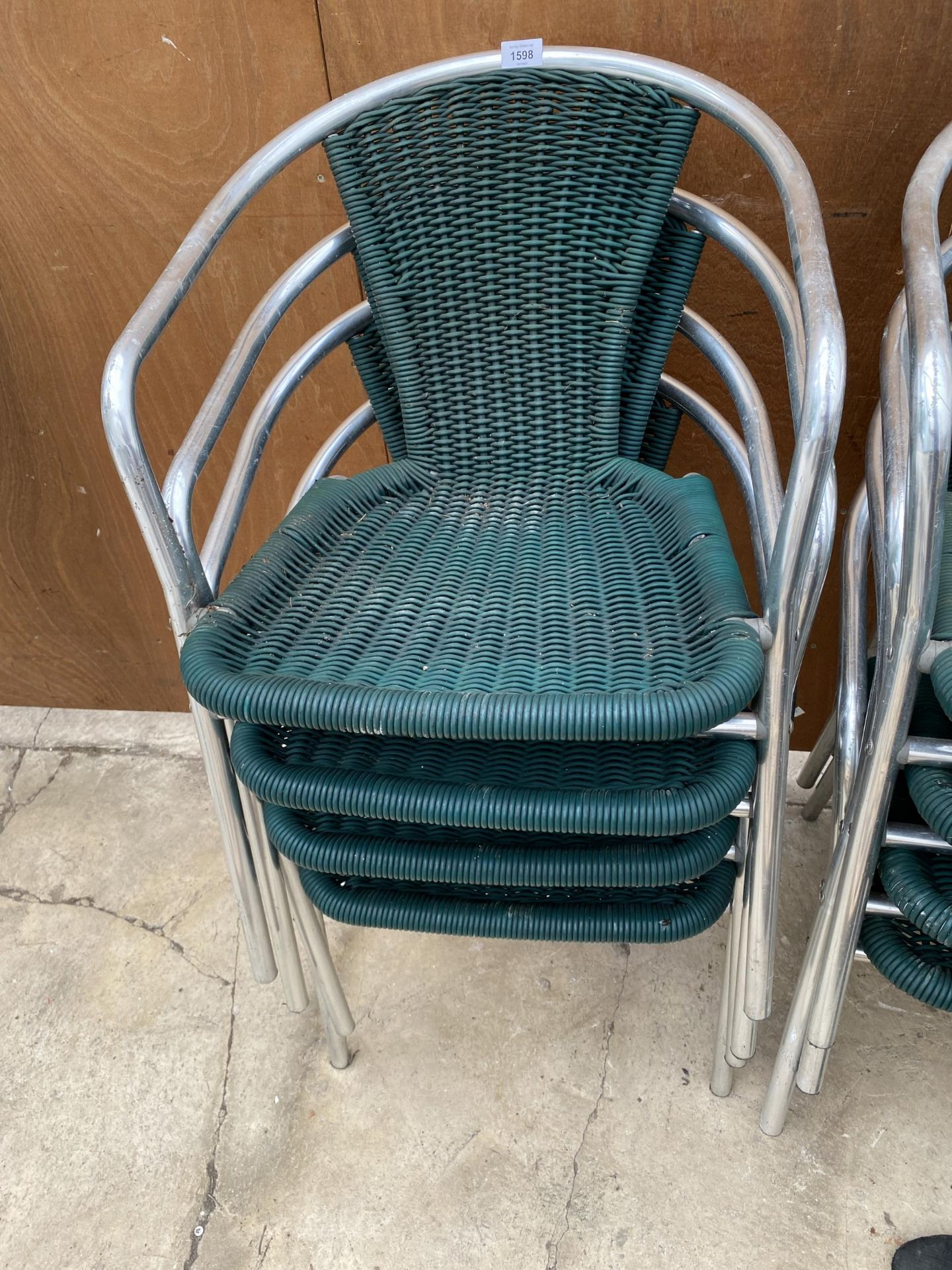 FOUR CHROME AND RATTAN BISTRO STACKING CHAIRS