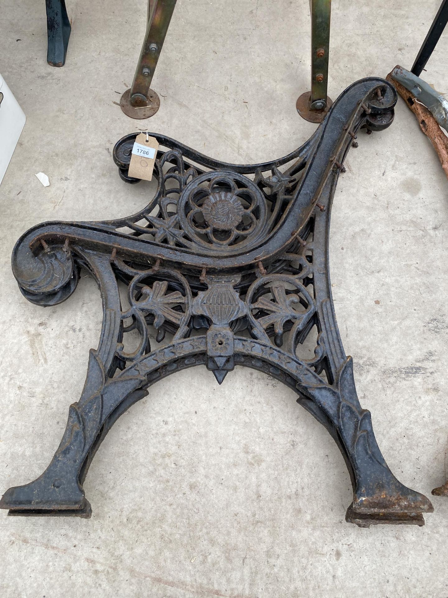 A PAIR OF DECORATIVE CAST IRON BENCH ENDS