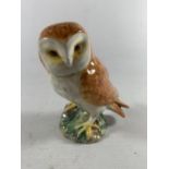 A BESWICK FIGURE OF A BARN OWL