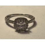 A 9 CARAT WHITE GOLD RING WITH A LARGE SQUARE CUBIC ZIRCONIA ALSO SURROUNDED AND ON THE SHOULDERS