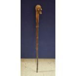 A VINTAGE WOODEN WALKING STICK WITH FIGURE HEAD DESIGN TOP
