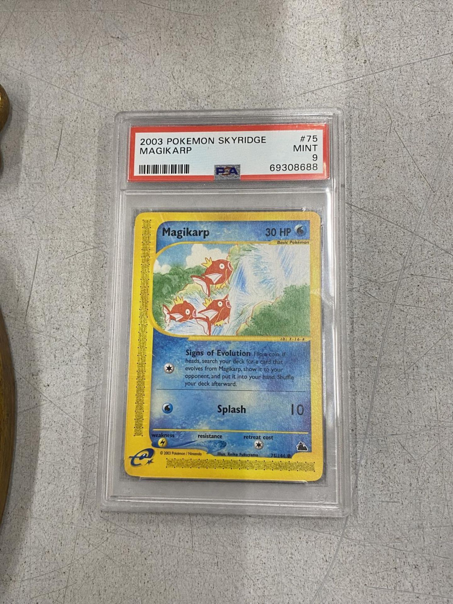 A GRADED POKEMON CARD - 2003 MAGIKARP SKYRIDGE 75/144 - PSA GRADE 9