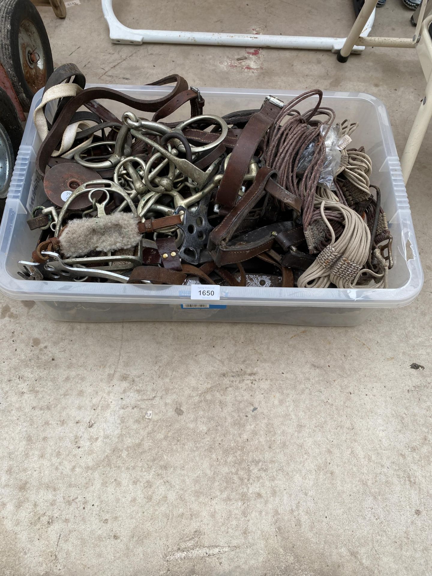 A LARGE ASSORTMENT OF VINTAGE HORSE TACK TO INCLUDE HEAD COLLARS, BITS AND STIRRUPS ETC