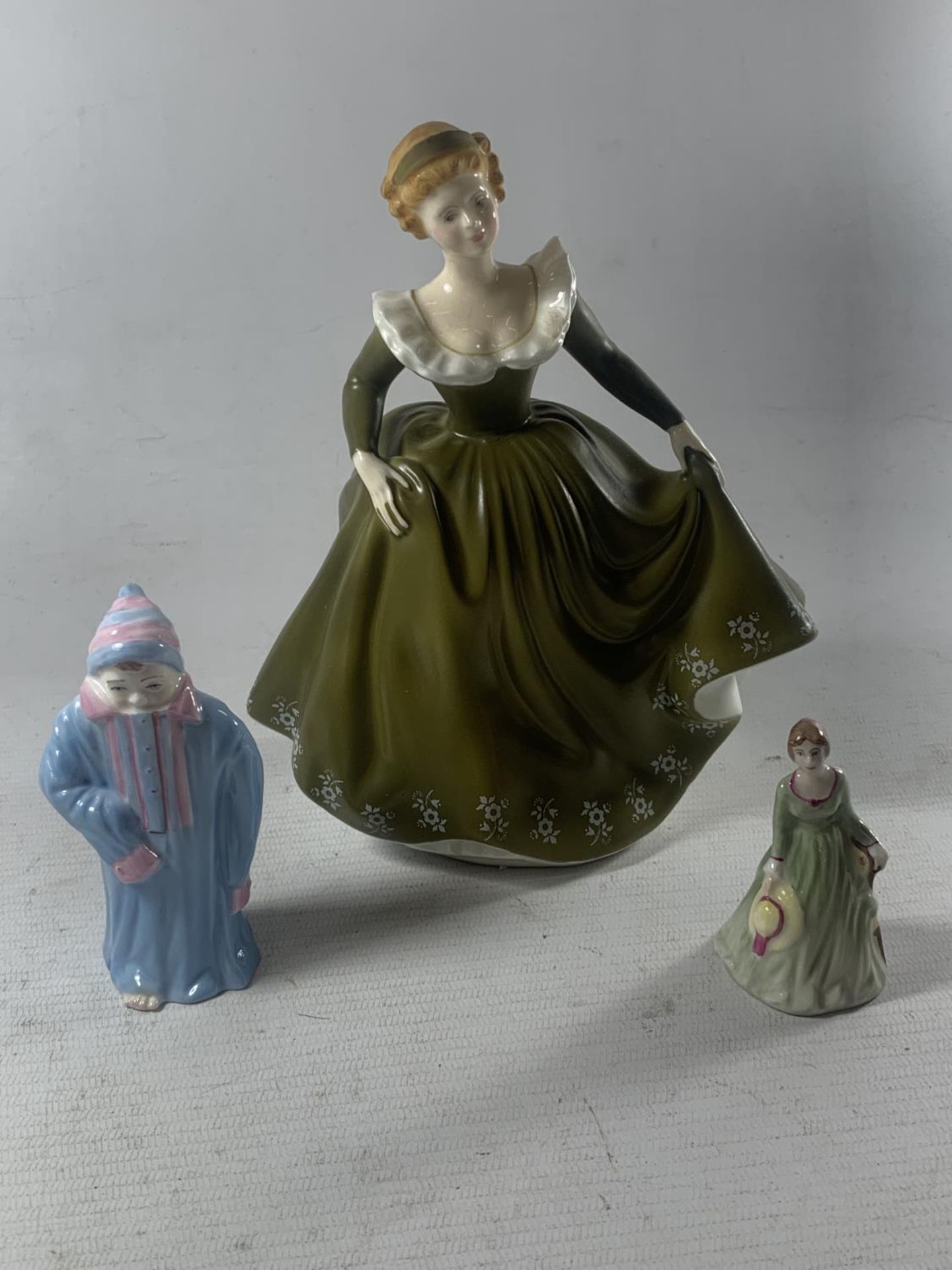 THREE FIGURES TO INCLUDE A ROYAL DOULTON GERALDINE, A V PEERS EVA AND TODDIE