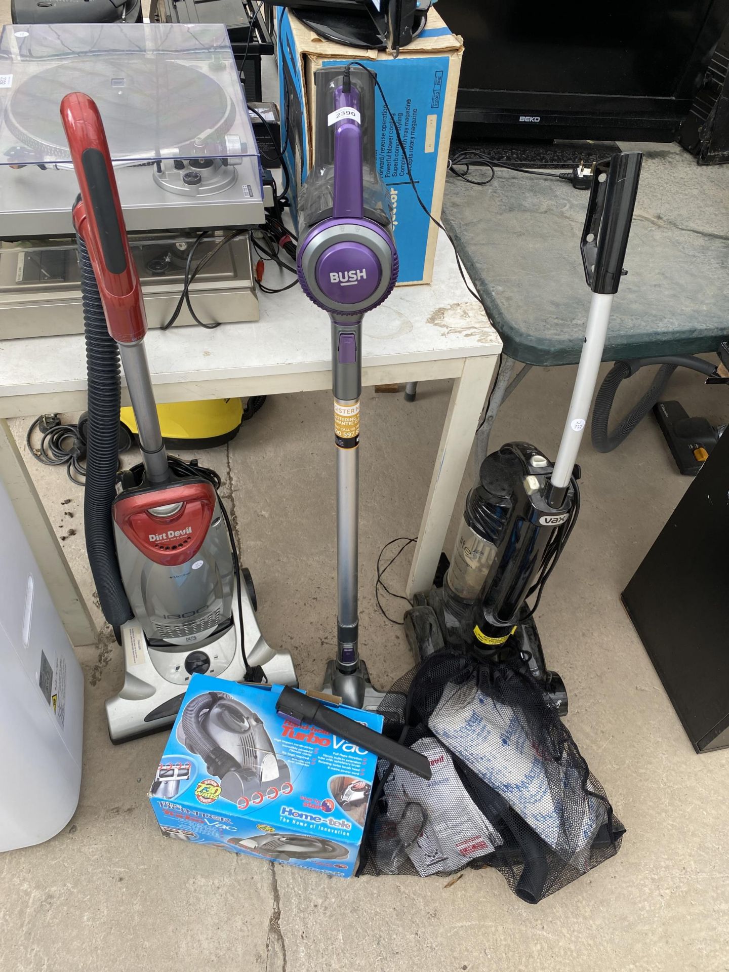 FOUR VARIOUS VACUUM CLEANERS TO INCLUDE A DIRT DEVIL AND A VAX ETC