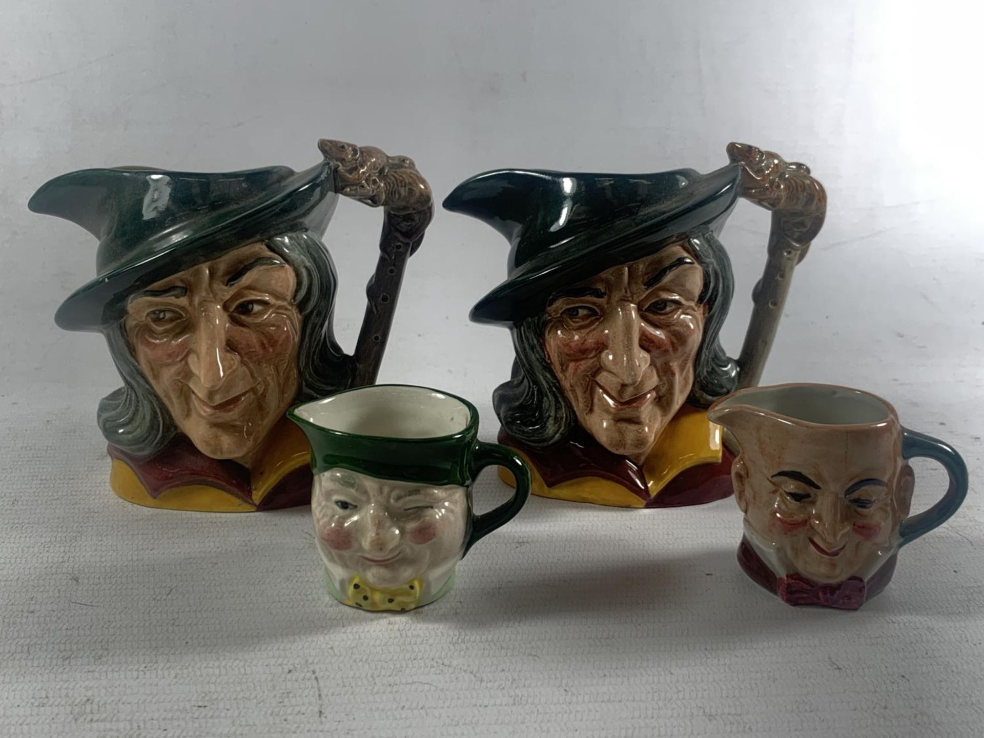 FOUR TOBY JUGS TO INCLUDE TWO ROYAL DOULTON PIED PIPER