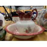 A VINTAGE EMPRESS IRONSTONE WASHBOWL AND JUG WITH ROSE DECORATION
