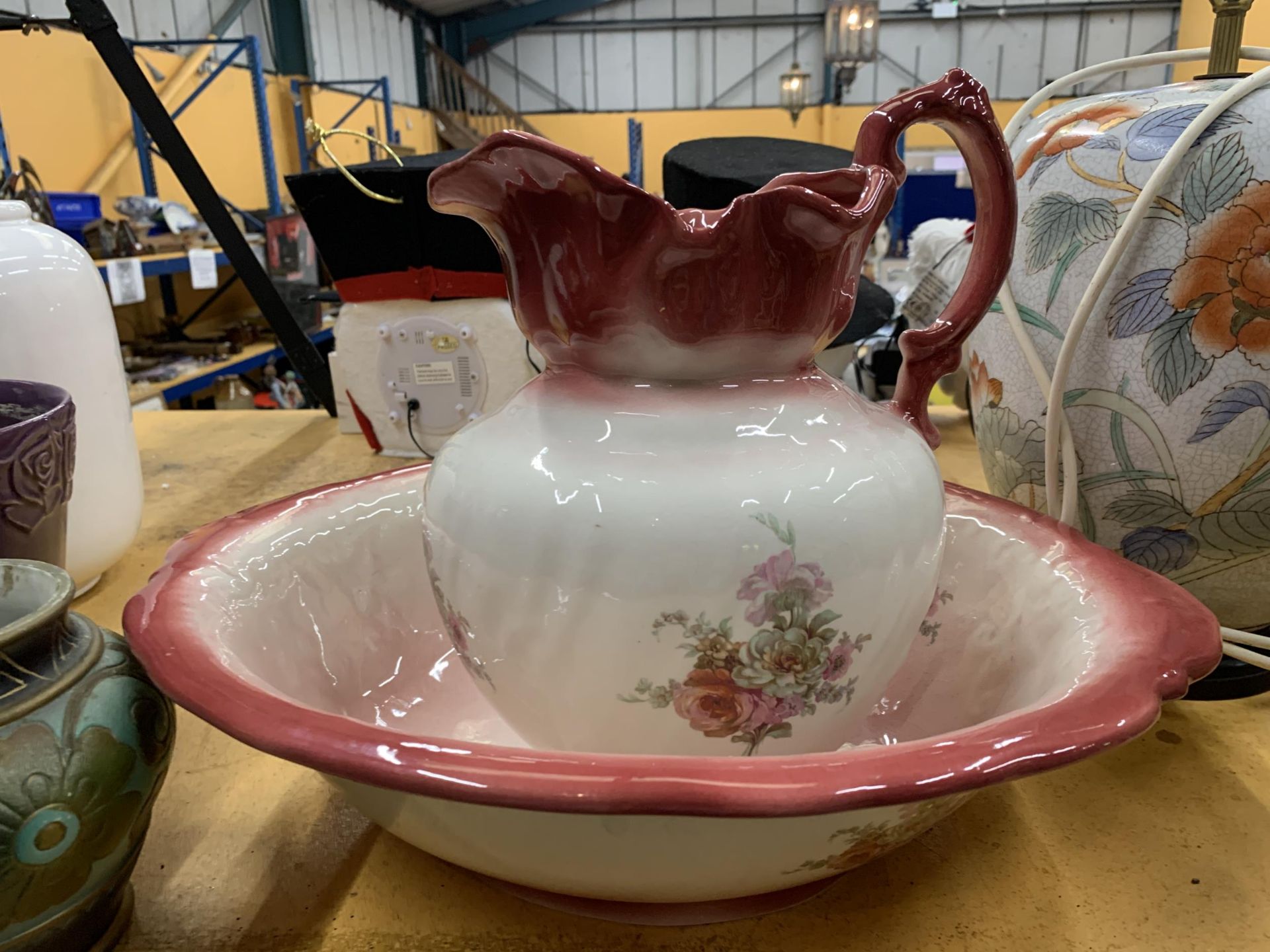A VINTAGE EMPRESS IRONSTONE WASHBOWL AND JUG WITH ROSE DECORATION