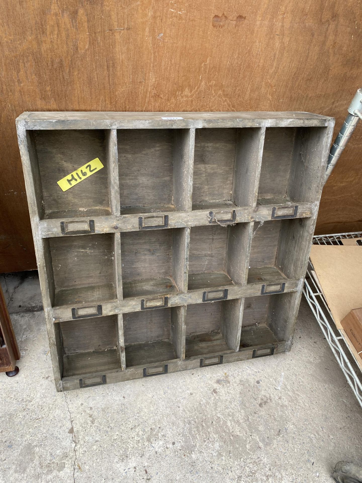 A VINTAGE 12 SECTION WOODEN PIGEON HOLE