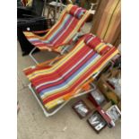 A PAIR OF VIVID COLOURFUL FOLDING DECK CHAIRS