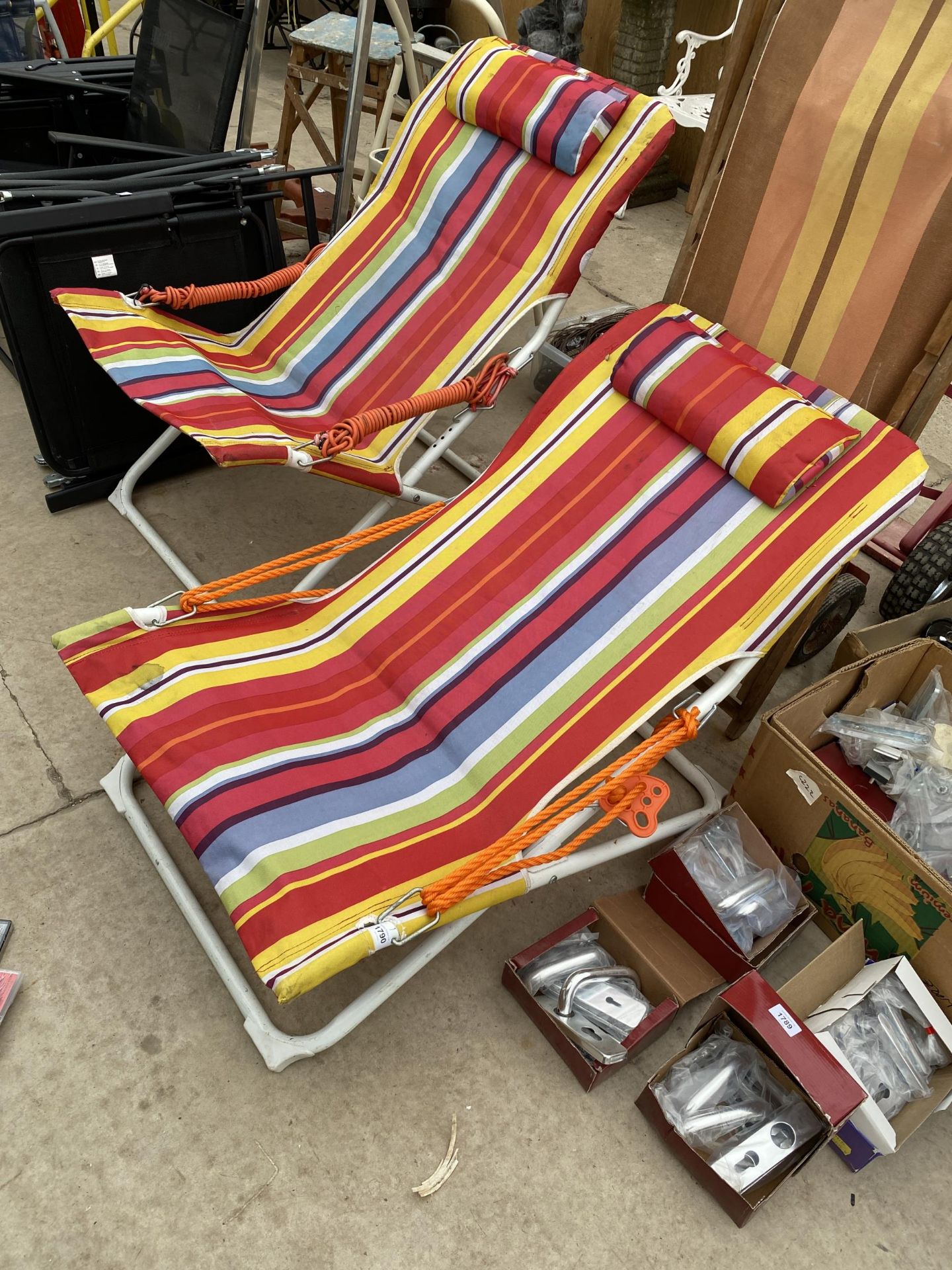 A PAIR OF VIVID COLOURFUL FOLDING DECK CHAIRS