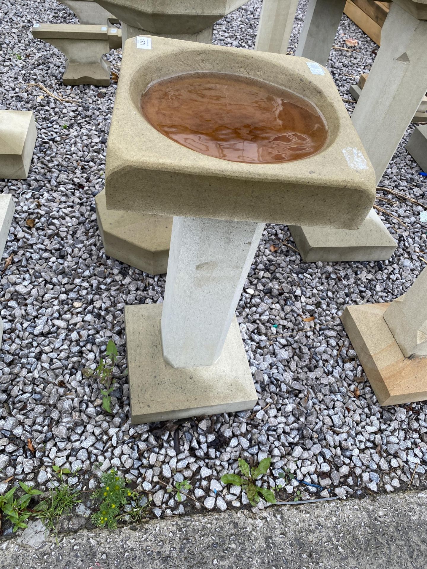 A DECORATIVE YORK STONE BIRD BATH WITH PEDESTAL BASE