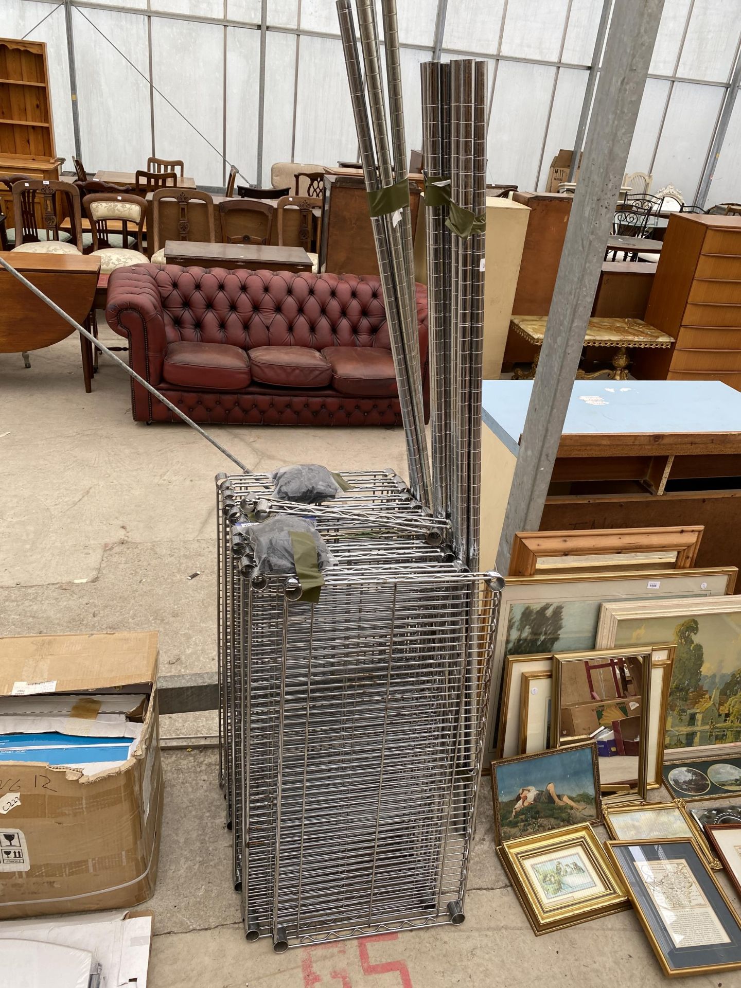 AN ASSORTMENT OF METAL SHELVING UNITS WITH WHEELED BASE