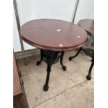 A 24.5" DIAMETER PUB TABLE ON A HEAVY CAST IRON BASE