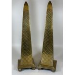 A PAIR OF HEAVY SOLID BRASS TALL OBELISK COLUMNS, HEIGHT 44CM