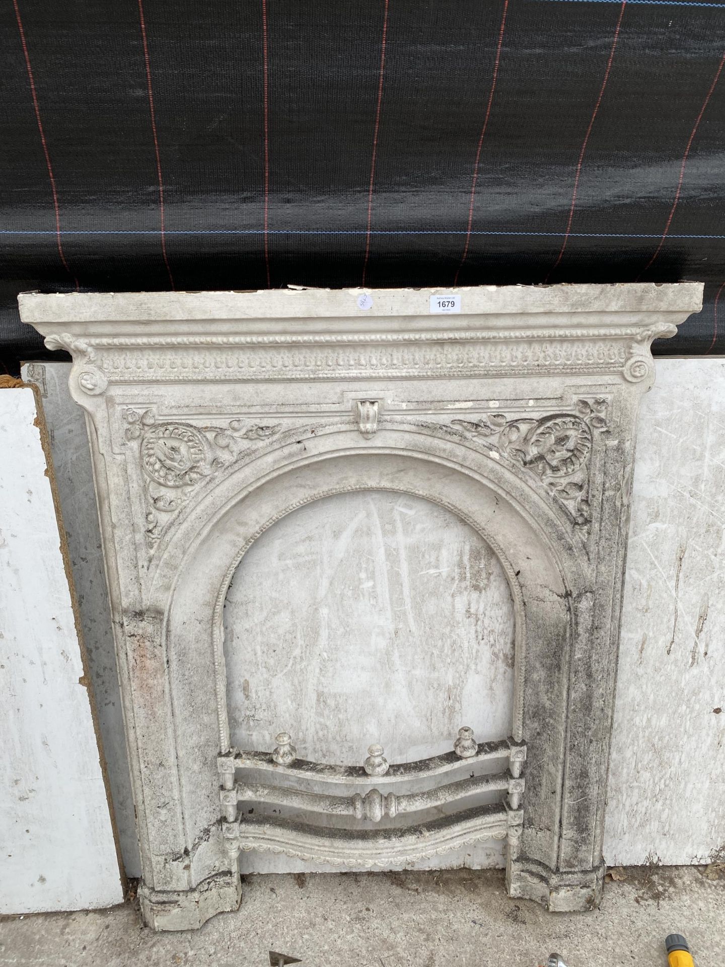 A VINTAGE CAST IRON FIRE SURROUND