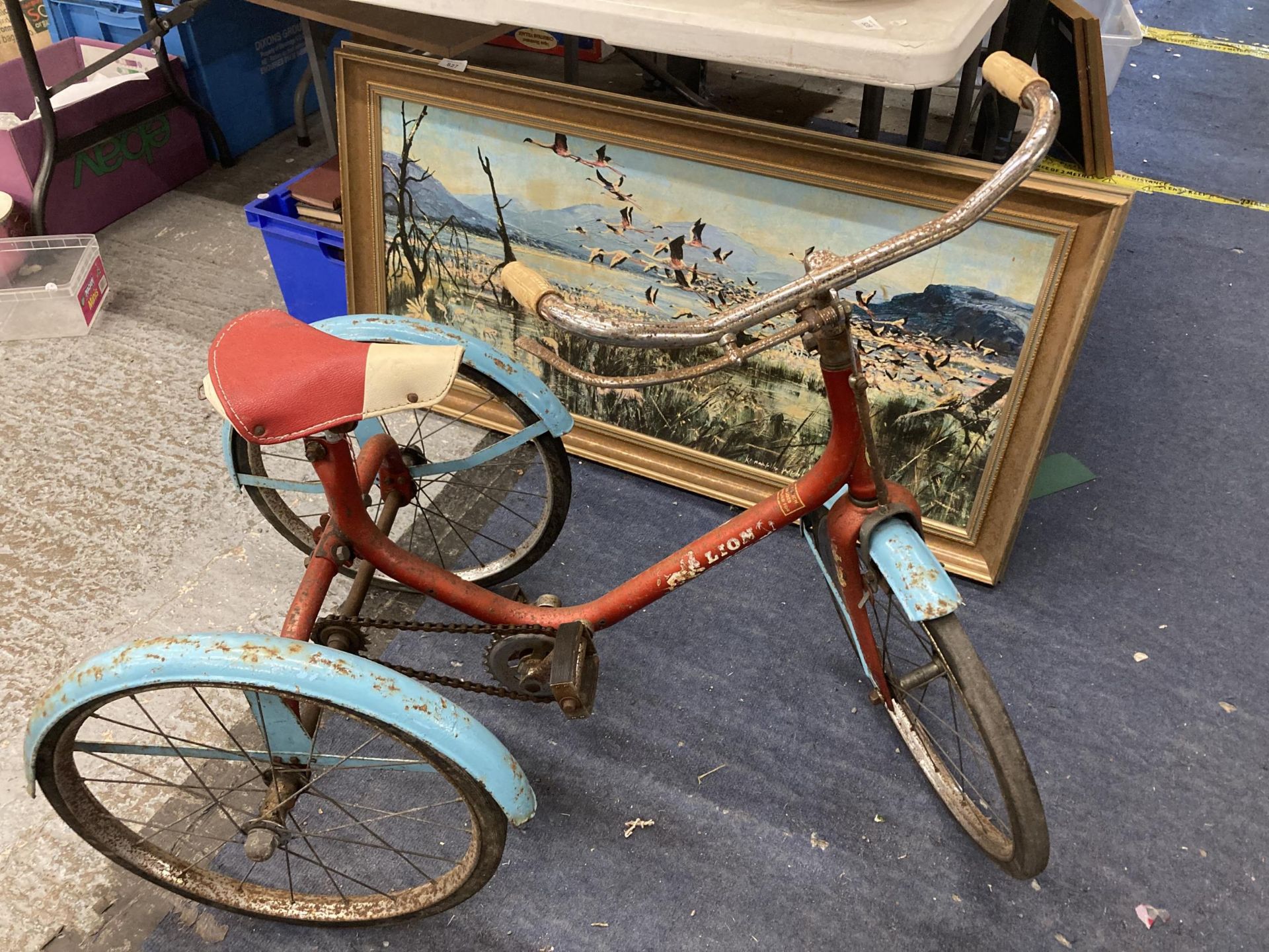 A VINTAGE LION CHILD'S TRICYCLE
