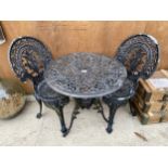 A VINTAGE CAST ALLOY BISTRO SET COMPRISING OF A ROUND TABLE AND TWO CHAIRS