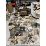 A LARGE COLLECTION OF VINTAGE SEPIA BLACK AND WHITE PHOTOGRAPHS, THREE IN FRAMES