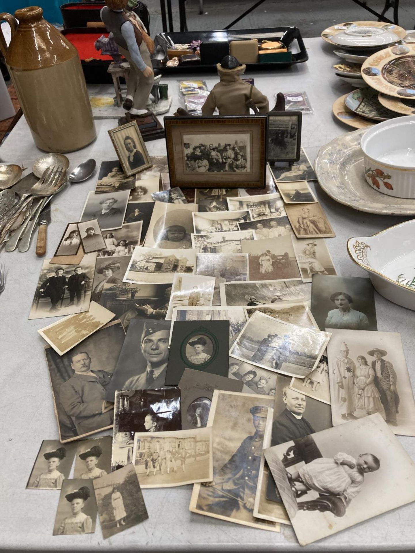 A LARGE COLLECTION OF VINTAGE SEPIA BLACK AND WHITE PHOTOGRAPHS, THREE IN FRAMES