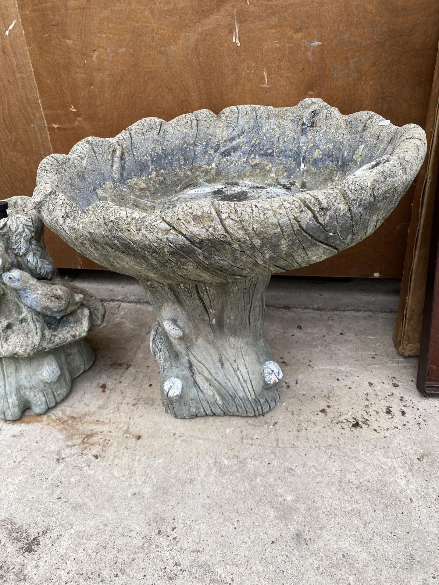 A LARGE RECONSTITUTED STONE BIRD BATH WITH PEDESTAL BASE