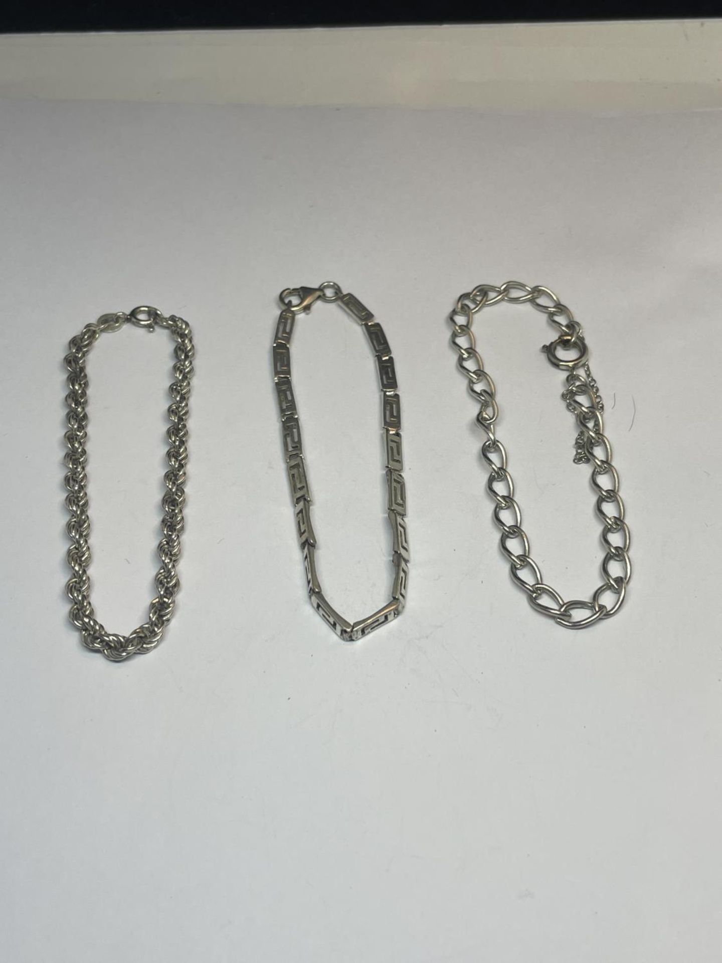 THREE SILVER BRACELETS