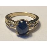 A 9 CARAT GOLD RING WITH A LARGE CENTRE SAPPHIRE AND DIAMONDS TO THE SHOULDERS SIZE N/O