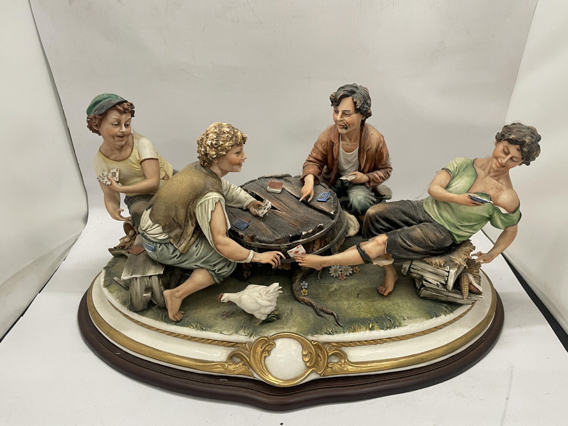 A CAPODIMONTE THE CARD CHEAT FIGURE GROUP, SIGNED CAZZOLA WITH TAG