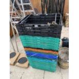 A LARGE QUANTITY OF PLASTIC STACKING CRATES