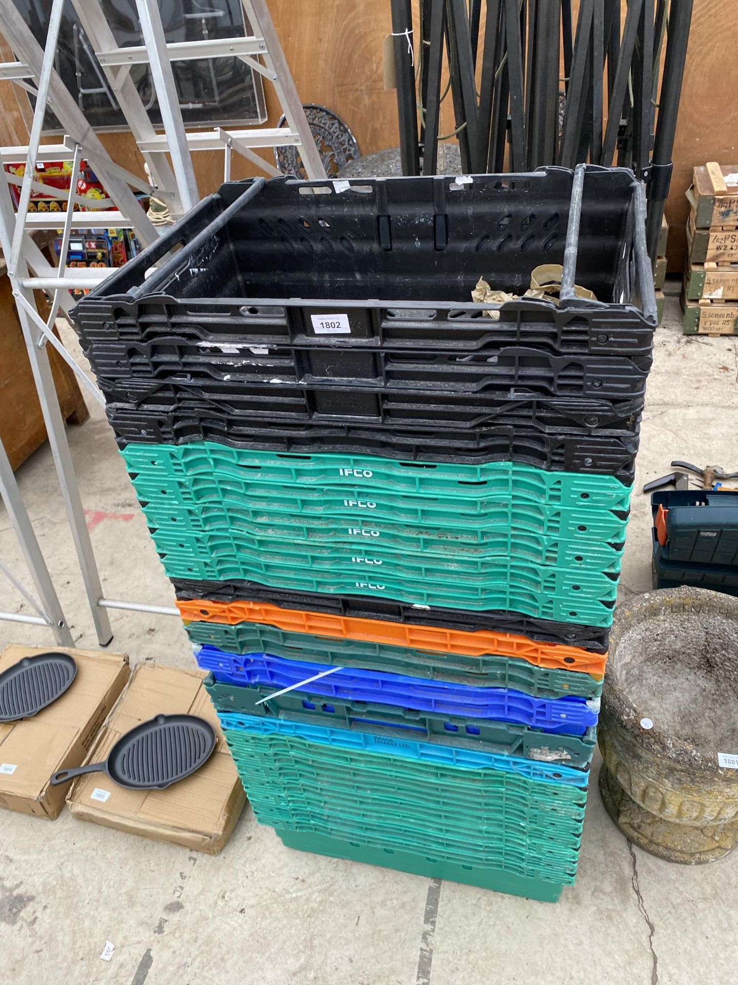 A LARGE QUANTITY OF PLASTIC STACKING CRATES