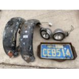 A COLLECTION OF VINTAGE MOTORCYCLE SPARES TO INCLUDE LIGHTS, MUDGUARDS, ETC