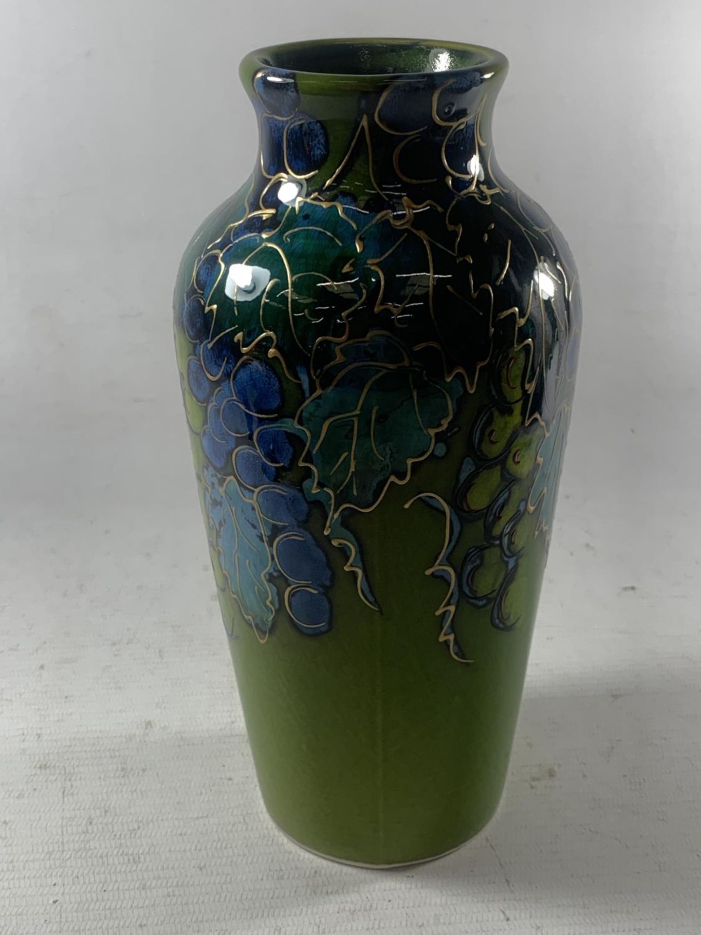 AN ANITA HARRIS HAND PAINTED AND SIGNED IN GOLD VINEYARD VASE