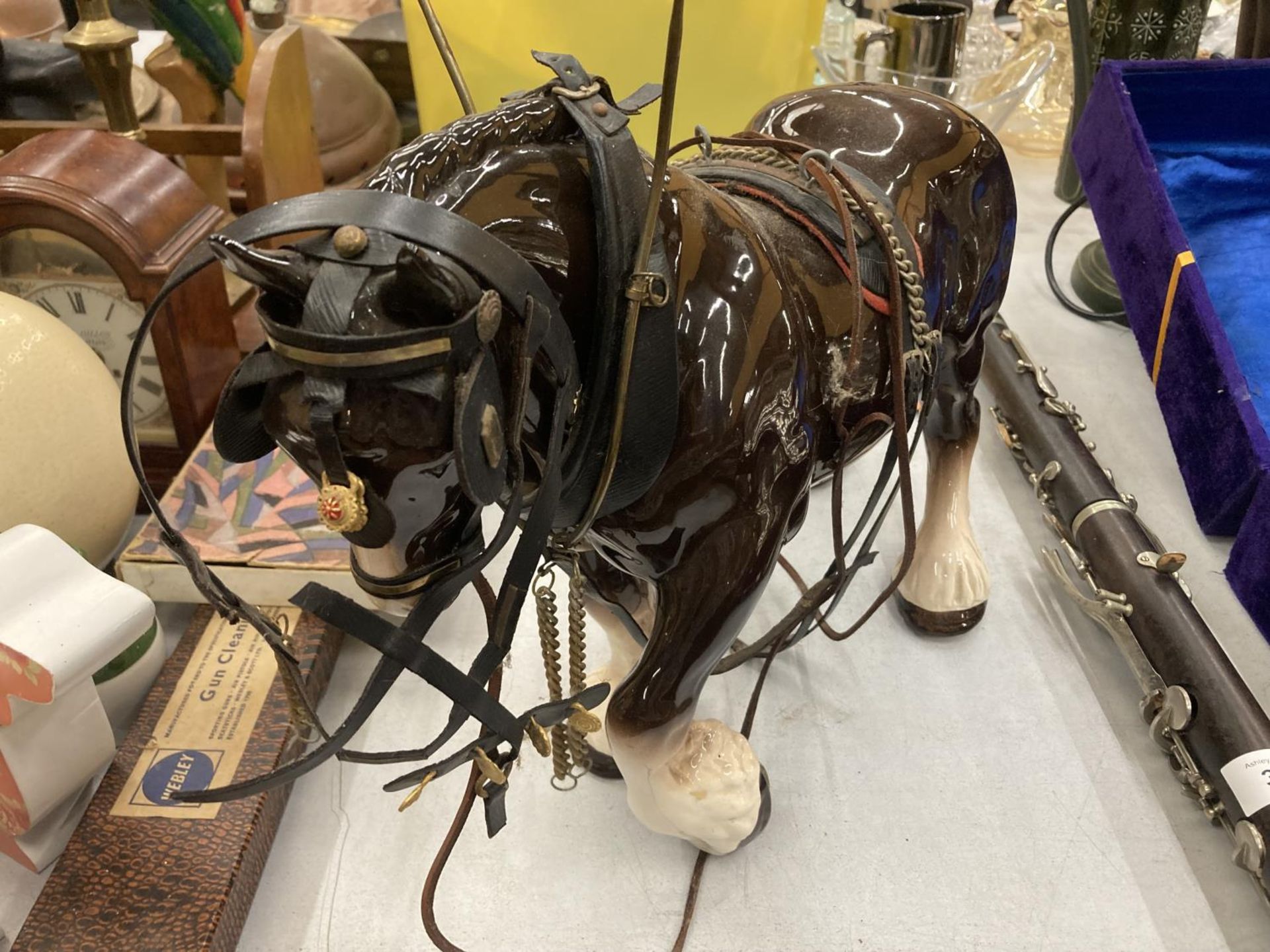 A VINTAGE CERAMIC SHIRE HORSE FIGURE WITH TACK ACCESSORIES